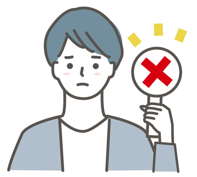 バツを上げる男性1