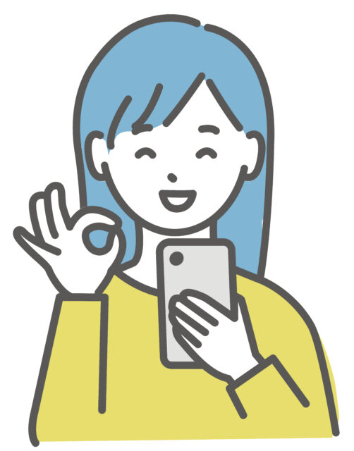 スマホを見てOKポーズの女性1